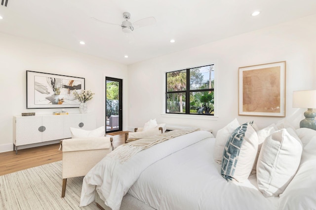 bedroom with ceiling fan and light wood-type flooring