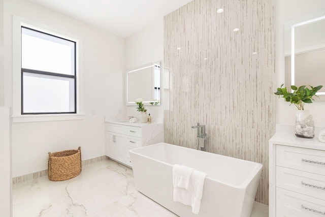 bathroom with vanity and a bathtub