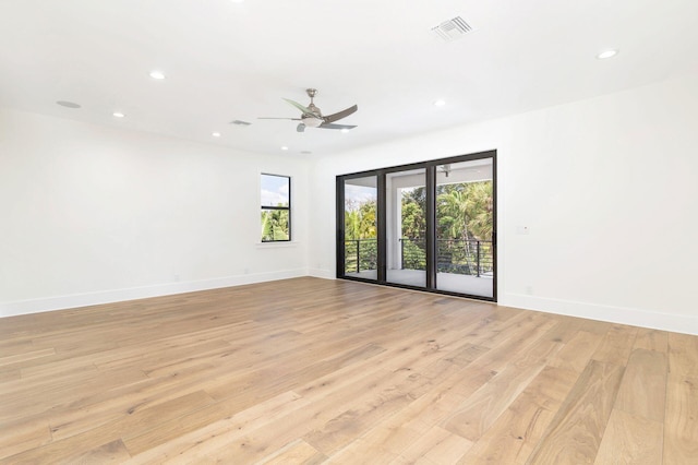 unfurnished room featuring ceiling fan and light wood-type flooring