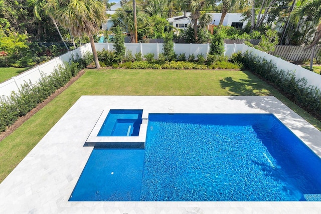 view of pool with an in ground hot tub, a yard, and a patio