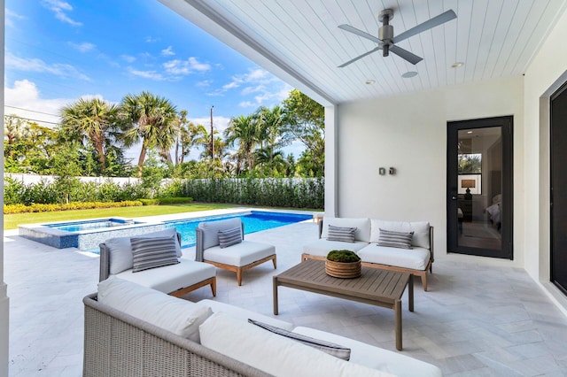 view of swimming pool featuring an outdoor living space, an in ground hot tub, ceiling fan, and a patio area