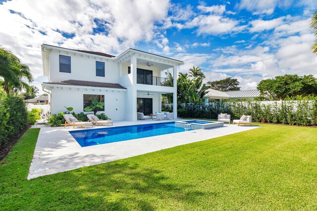 view of front of home featuring a garage, a front lawn, and a carport