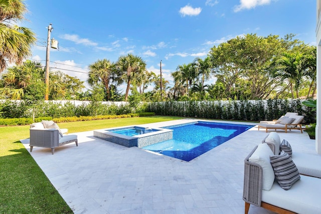 view of pool featuring a patio area, a lawn, and an in ground hot tub