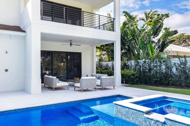 view of pool with an in ground hot tub, ceiling fan, an outdoor living space, and a patio area