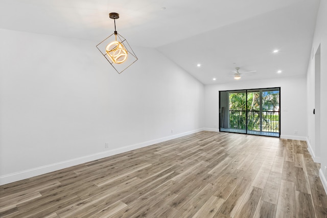 unfurnished living room with lofted ceiling, ceiling fan, and light hardwood / wood-style floors