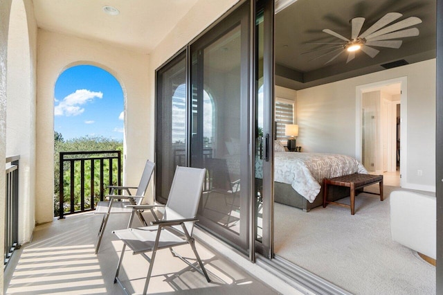 bedroom with ceiling fan and light colored carpet