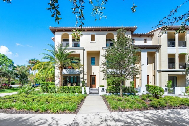 mediterranean / spanish home with a balcony