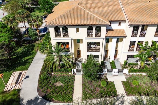 back of house featuring a balcony