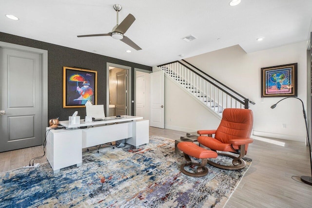 interior space featuring light wood-type flooring and ceiling fan