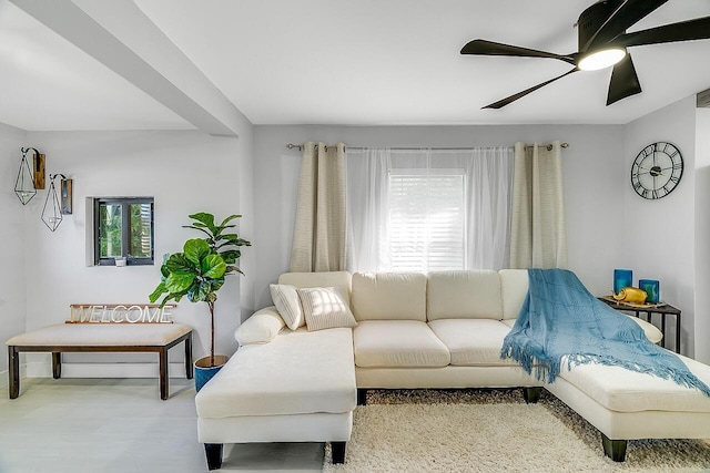 living room with a wealth of natural light and ceiling fan