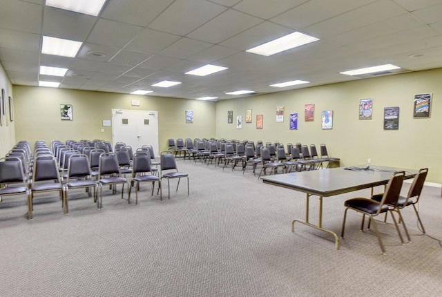 interior space featuring carpet and a drop ceiling