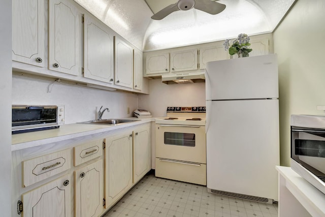 kitchen featuring ceiling fan, white appliances, and sink