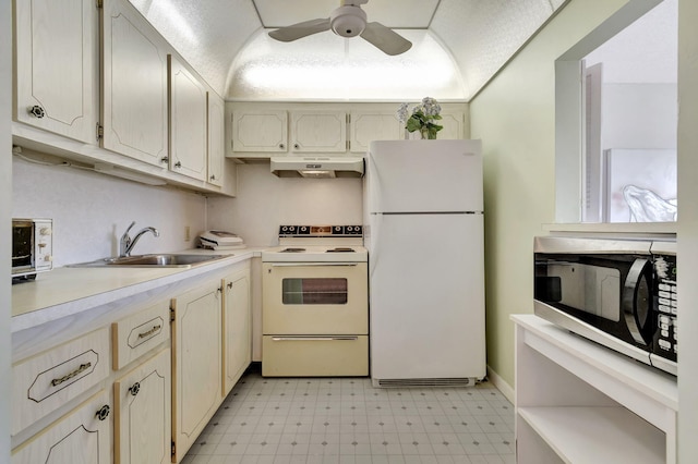 kitchen featuring ceiling fan, white appliances, and sink