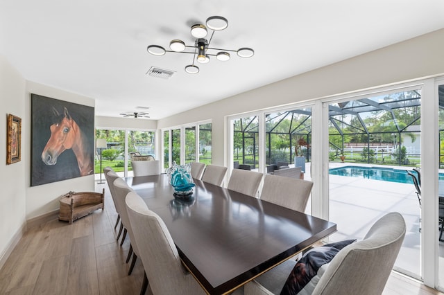 dining room featuring light hardwood / wood-style flooring and a wealth of natural light