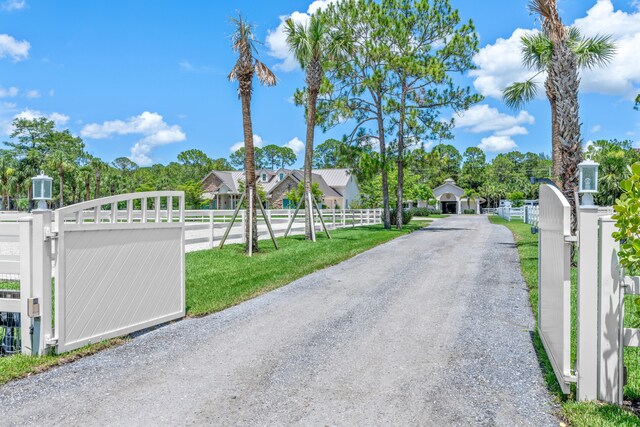 1464 Stallion Dr, Loxahatchee, FL 33470 - view of dirt / gravel driveway with a gate and a gated entry