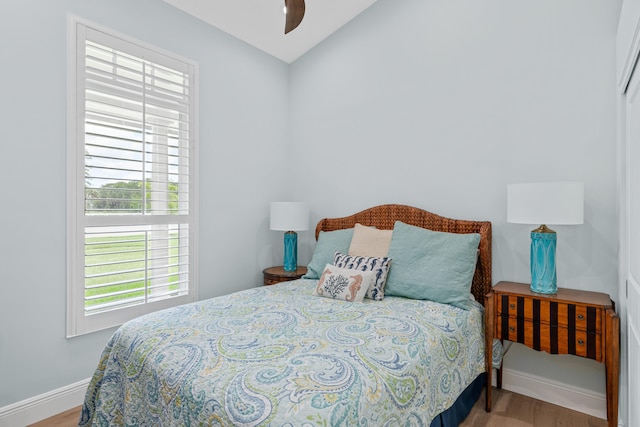 1464 Stallion Dr, Loxahatchee, FL 33470 - bedroom with wood finished floors, baseboards, vaulted ceiling, and a ceiling fan