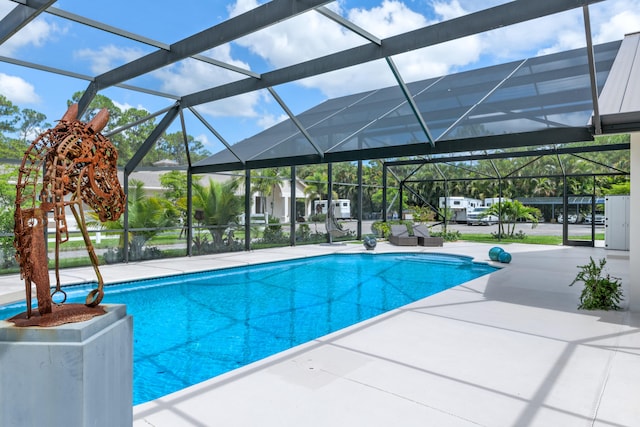 view of pool featuring a patio and glass enclosure