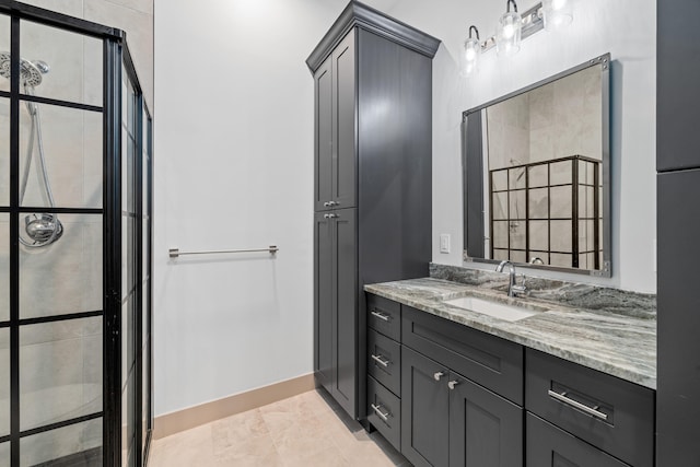 bathroom featuring vanity, an inviting chandelier, and walk in shower