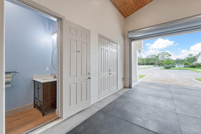 interior space with wooden ceiling and sink