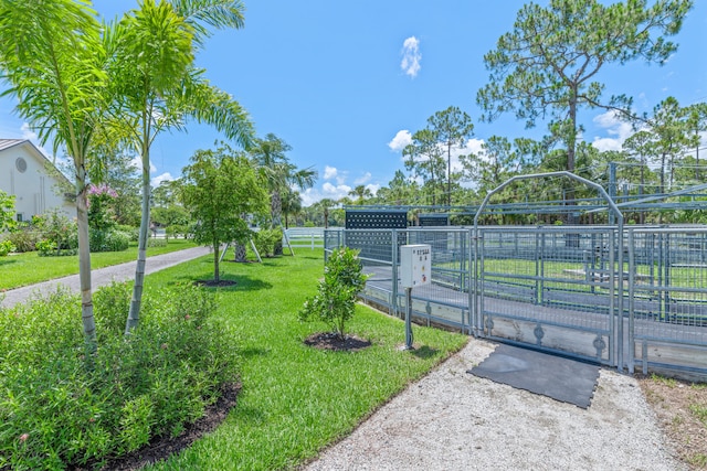 1464 Stallion Dr, Loxahatchee, FL 33470 - view of home's community with a gate