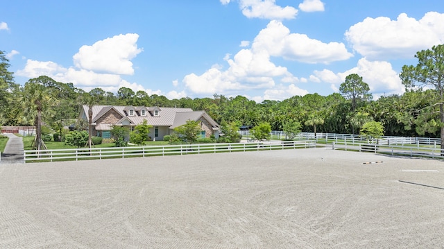 view of front of home with a rural view