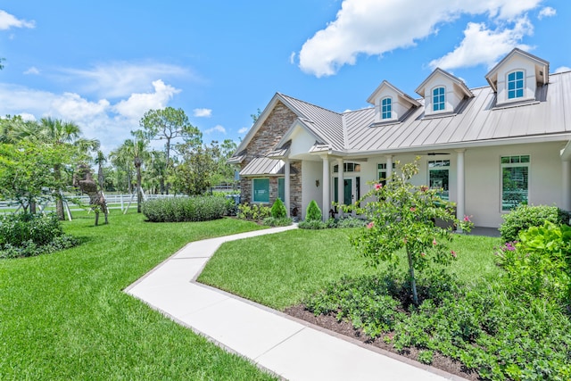 1464 Stallion Dr, Loxahatchee, FL 33470 - view of front of home with a standing seam roof, stone siding, metal roof, and stucco siding