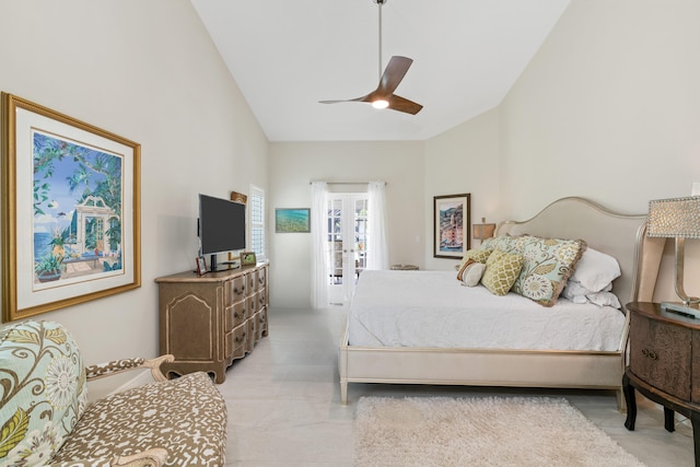 bedroom featuring ceiling fan and high vaulted ceiling