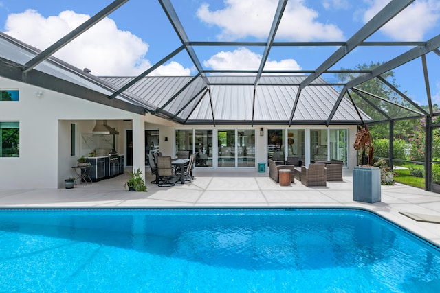 view of swimming pool with a patio, an outdoor living space, and glass enclosure