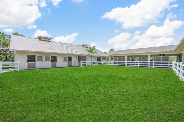 1464 Stallion Dr, Loxahatchee, FL 33470 - rear view of property featuring metal roof, a standing seam roof, stucco siding, and an exterior structure