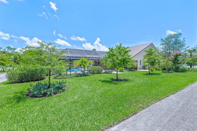 1464 Stallion Dr, Loxahatchee, FL 33470 - view of green lawn with an outdoor pool and a lanai