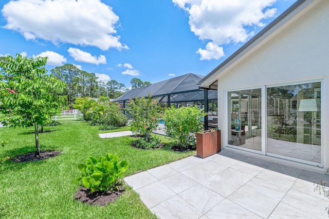 view of yard with a patio area and a lanai