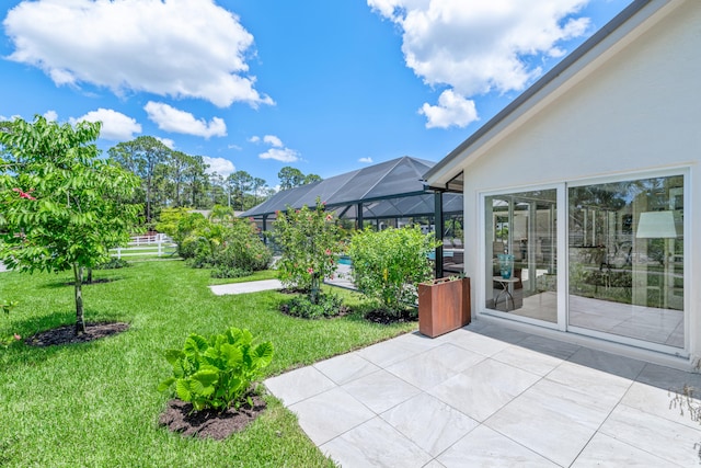 1464 Stallion Dr, Loxahatchee, FL 33470 - view of green lawn featuring a patio area and glass enclosure