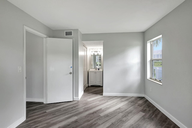 spare room featuring hardwood / wood-style flooring