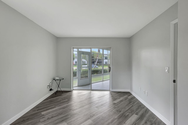 3200 SE Aster Ln Unit S-102, Stuart, FL 34994 - spare room with wood finished floors and baseboards