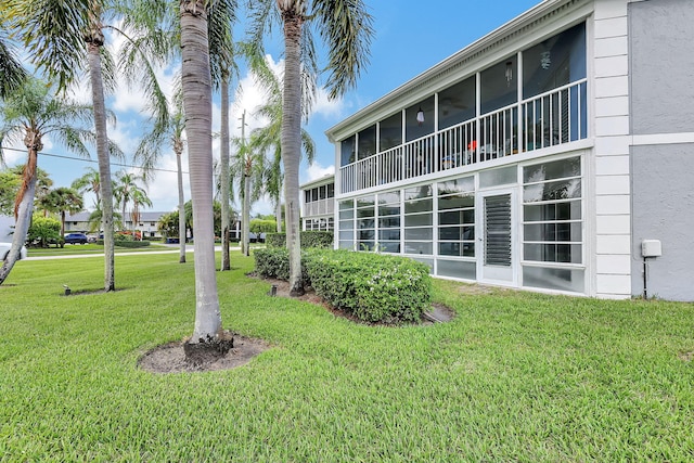 3200 SE Aster Ln Unit S-102, Stuart, FL 34994 - view of grassy yard with a sunroom