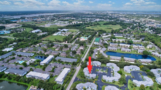 3200 SE Aster Ln Unit S-102, Stuart, FL 34994 - aerial overview of property's location featuring a large body of water and nearby suburban area