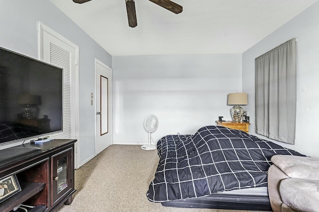 bedroom with ceiling fan and light colored carpet