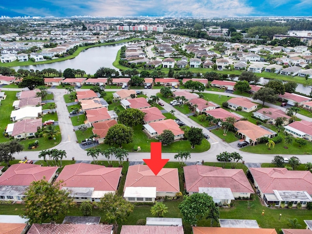 drone / aerial view with a water view