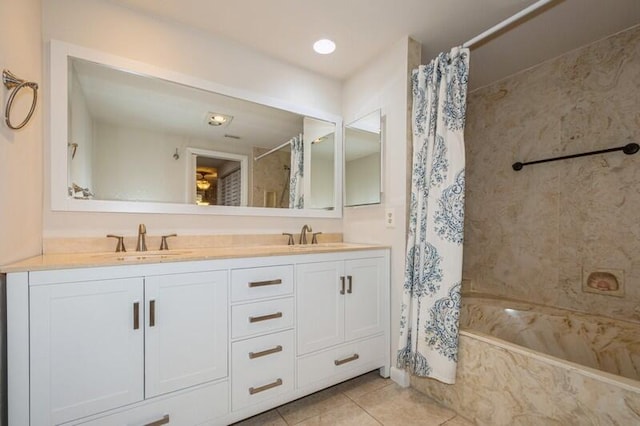 bathroom featuring shower / bath combination with curtain, vanity, and tile patterned flooring