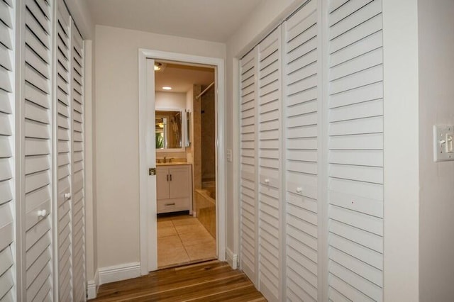 hallway with wood-type flooring