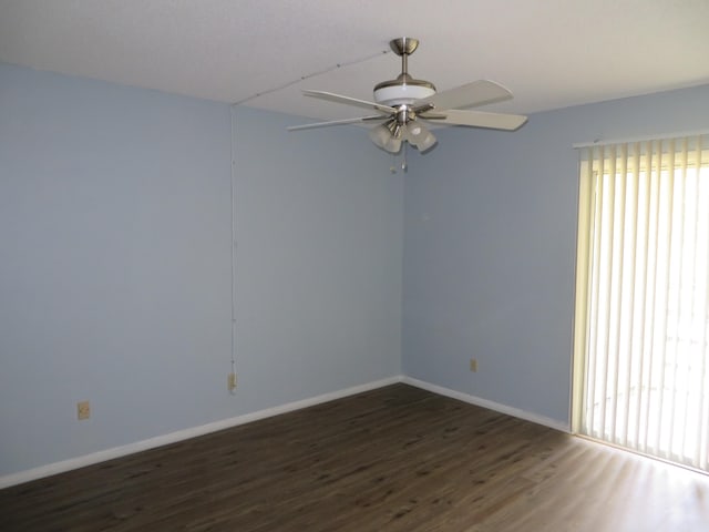 unfurnished room featuring dark hardwood / wood-style flooring and ceiling fan