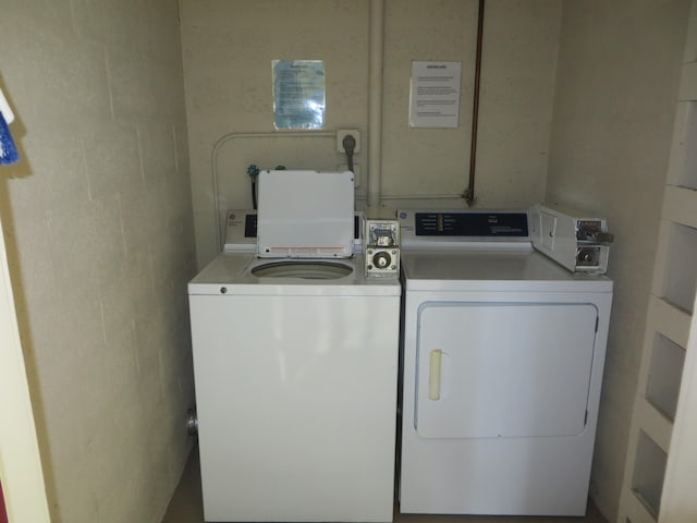 washroom with washer and dryer