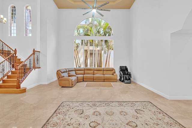 living room featuring a towering ceiling