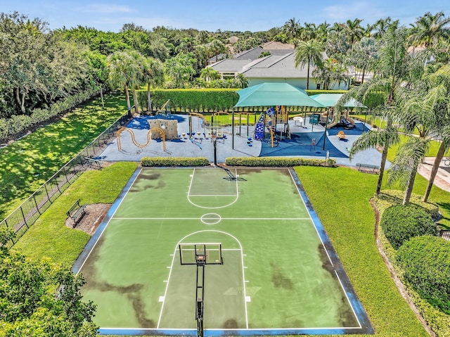 view of community with a yard and basketball court