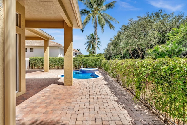 view of swimming pool featuring a patio area