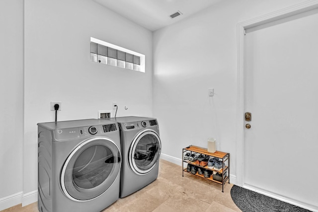 laundry room featuring washing machine and dryer