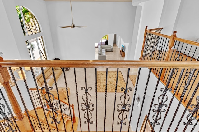 stairway featuring a high ceiling