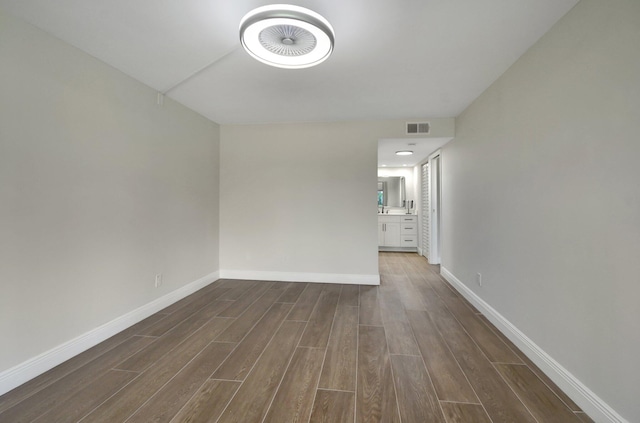 spare room featuring dark hardwood / wood-style floors