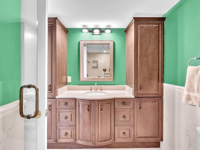2200 S Ocean Blvd Unit 806, Delray Beach, FL 33483 - bathroom with vanity, wainscoting, and a shower