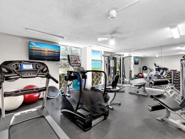 gym with a textured ceiling